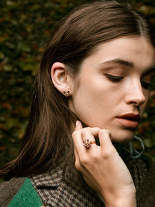 Model wearing the Rose Cluster Earrings and Ring