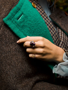 Close up of a models hand wearing the Garden of Eden Ring